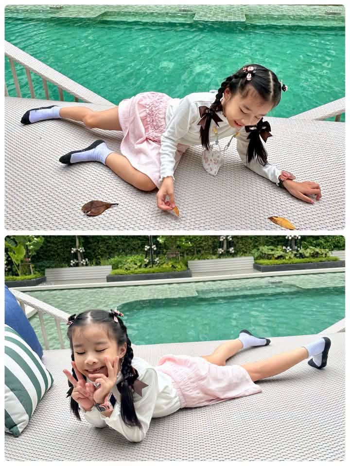 เด็กหญิงนอนเล่นริมสระว่ายน้ำส่วนกลาง โดยคุณ Phanyaporn Bewty Sa-ardeam สะท้อนความสุขใกล้ฉัน จากคอนโด AP